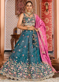 Designer teal wedding guest lehenga with pink dupatta