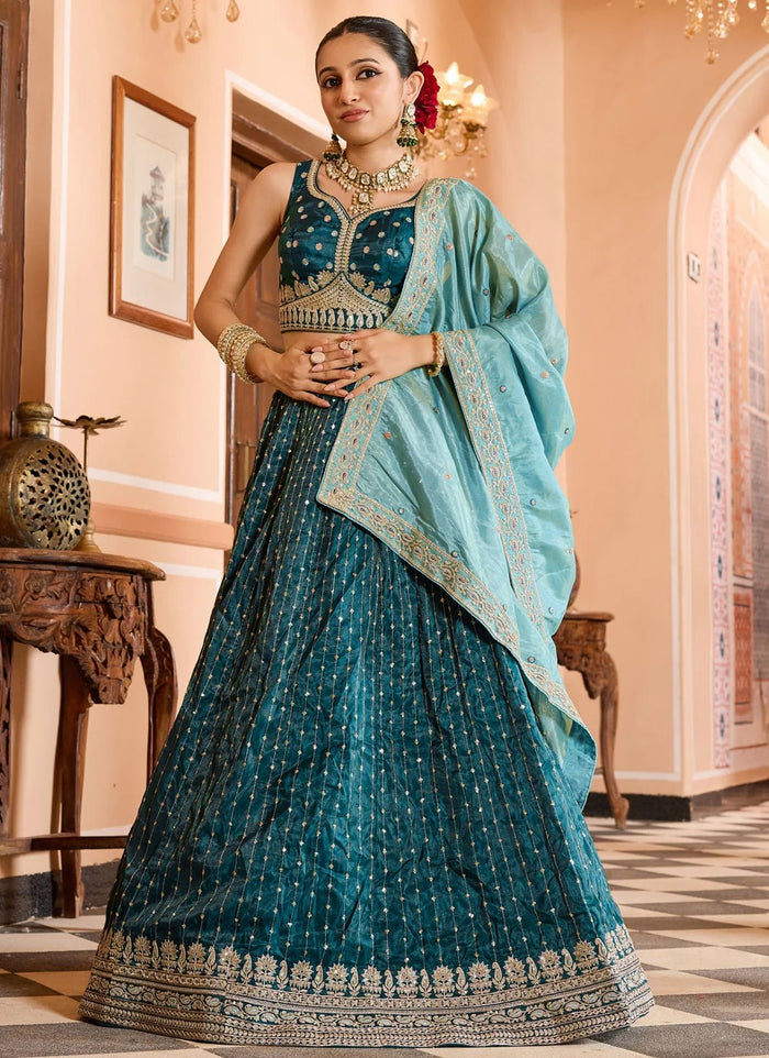 Teal tissue silk reception lehenga with zari embroidery