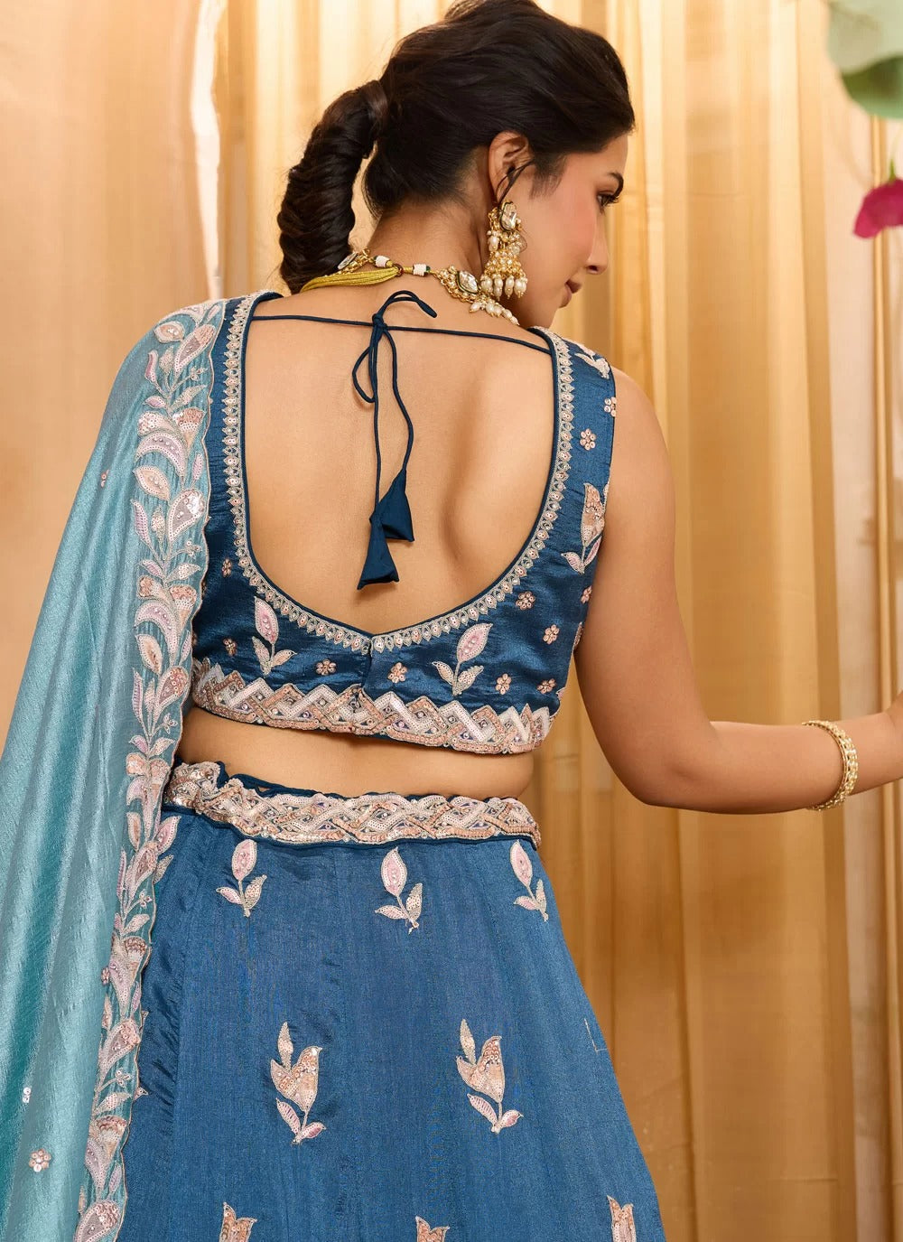 Handmade latkan detail on teal silk wedding lehenga