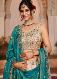 Woman in traditional embroidered outfit with jewelry against a decorative background