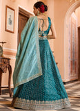 Luxury teal bridesmaid lehenga with pink dupatta