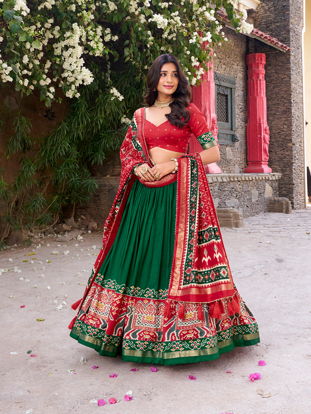Green Tasar silk lehenga with Patola print and foil work