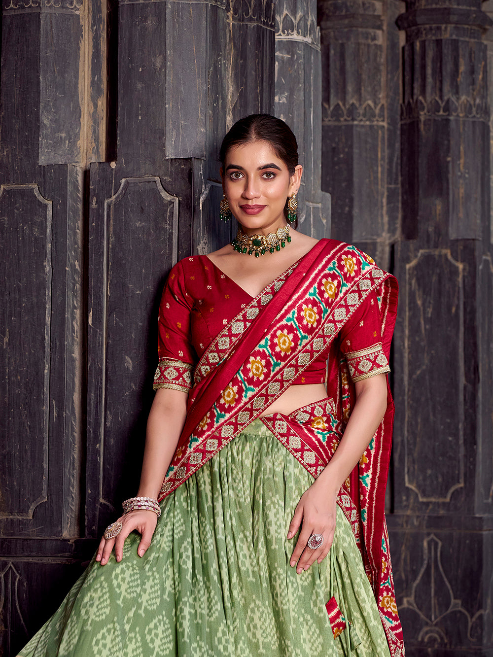 Sea green lehenga with embroidered red blouse and dupatta