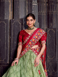 Sea green lehenga with embroidered red blouse and dupatta