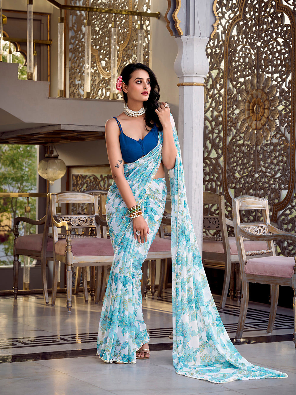 Sky blue floral marble saree with pearl lace border