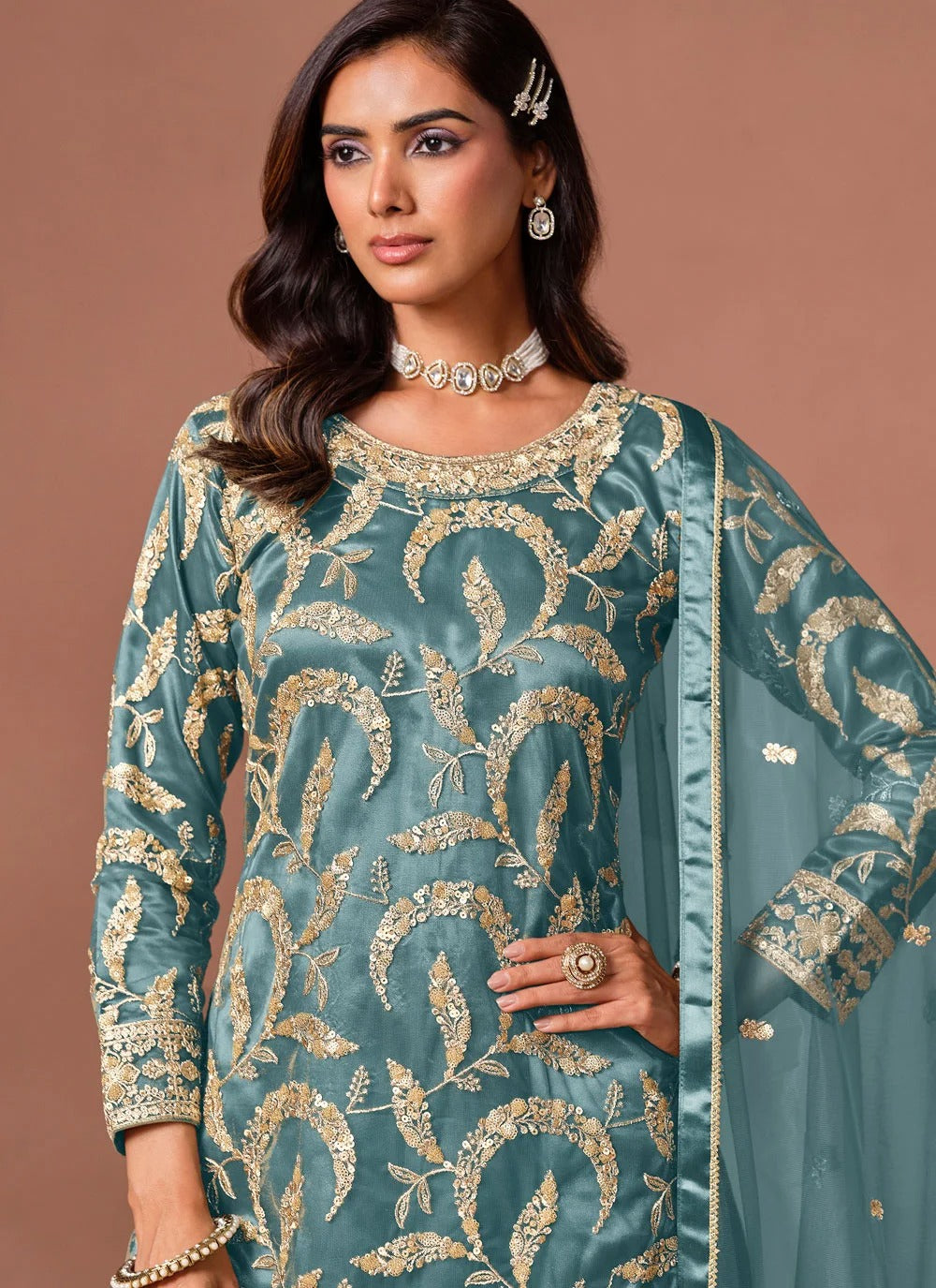 Turquoise party wear palazzo suit with detailed zari and sequins embellishment