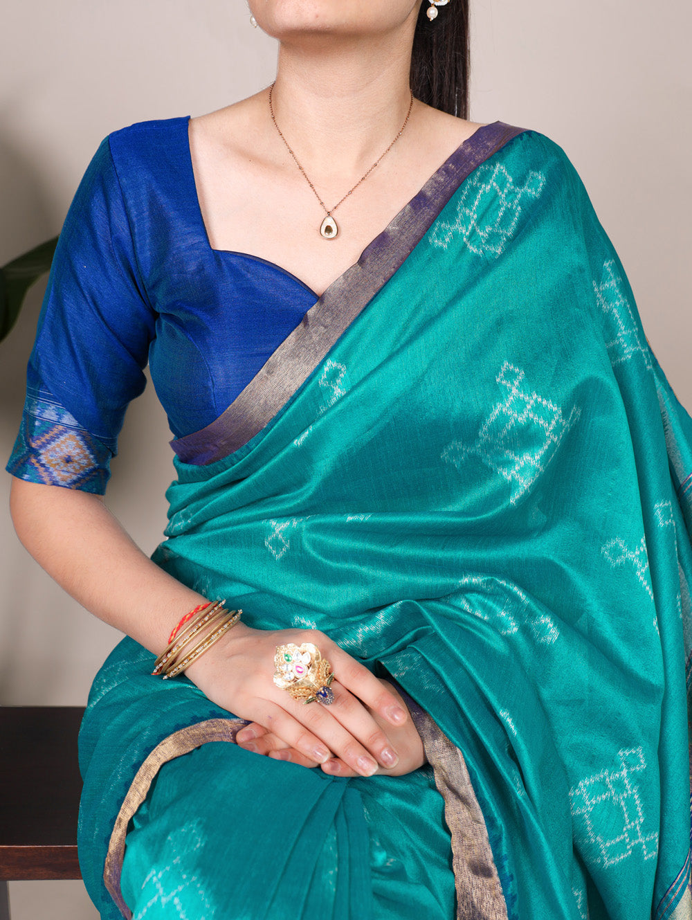 Traditional teal saree with zari work