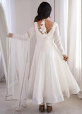 Elegant white reception wear Anarkali suit with full flare
