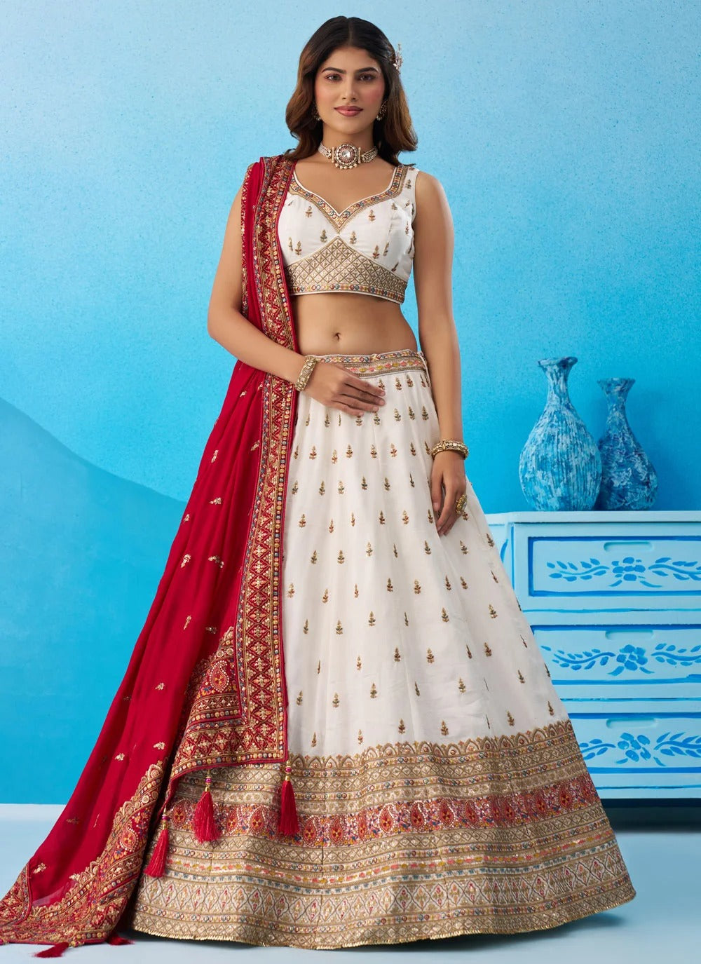 White Chinnon Silk wedding lehenga with sequins, thread and zari embroidery featuring a 4-metre flared silhouette.