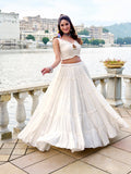 White traditional lehenga choli with koti